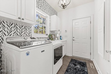 Nestled on the golf course in the gated community of Seven Lakes on Beacon Ridge Golf and Country Club in North Carolina - for sale on GolfHomes.com, golf home, golf lot