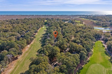 Tucked inside the gated, tree-lined entrance of Pawleys on Pawleys Plantation Golf and Country Club in South Carolina - for sale on GolfHomes.com, golf home, golf lot