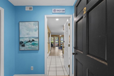 Tucked inside the gated, tree-lined entrance of Pawleys on Pawleys Plantation Golf and Country Club in South Carolina - for sale on GolfHomes.com, golf home, golf lot