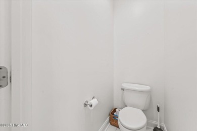 Nestled on the golf course in the gated community of Seven Lakes on Beacon Ridge Golf and Country Club in North Carolina - for sale on GolfHomes.com, golf home, golf lot