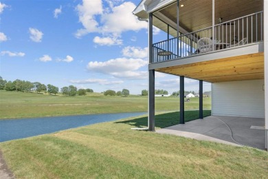 This 2024 Parade of Homes by Hodge Construction overlooks the on Saddleback Ridge Golf Course in Iowa - for sale on GolfHomes.com, golf home, golf lot