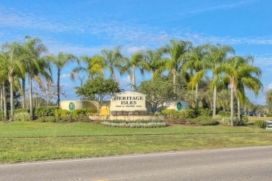 Beautiful well-maintained home on a gorgeous golf course lot in on Heritage Isles Golf and Country Club in Florida - for sale on GolfHomes.com, golf home, golf lot