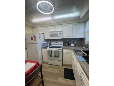 Beautiful 2/2 ready to move in condo located in the desirable on Sunrise Lakes Phase IV Golf Course in Florida - for sale on GolfHomes.com, golf home, golf lot