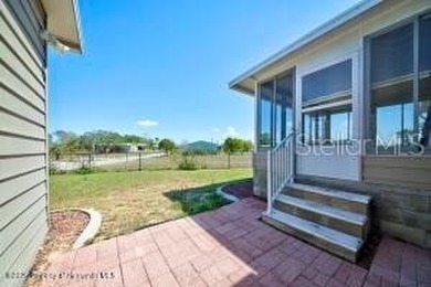 Welcome to your dream abode, nestled on a desirable corner lot on Brookridge Country Club in Florida - for sale on GolfHomes.com, golf home, golf lot