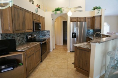Impressive WATERFRONT home on an oversized lot in desirable deed on Twin Isles Country Club in Florida - for sale on GolfHomes.com, golf home, golf lot