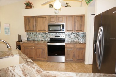 Impressive WATERFRONT home on an oversized lot in desirable deed on Twin Isles Country Club in Florida - for sale on GolfHomes.com, golf home, golf lot