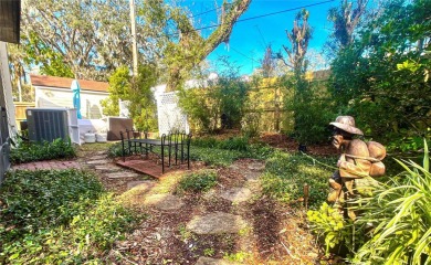 Charming brick facade 3-bedroom, 2-bath house with wood floors on Temple Terrace Golf and Country Club in Florida - for sale on GolfHomes.com, golf home, golf lot