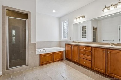 Nestled on a 1.2-acre cul-de-sac lot in Stonehouse, this 2817 sq on The Tradition Golf Club At Stonehouse in Virginia - for sale on GolfHomes.com, golf home, golf lot