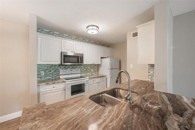 Welcome to Unit 903, a beautifully updated 1-bedroom, 1-bath on Hunters Green Country Club in Florida - for sale on GolfHomes.com, golf home, golf lot
