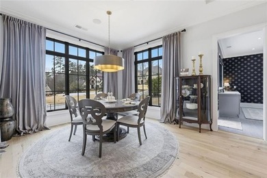 Situated within the prestigious Indian Hills Country Club on Indian Hills Country Club in Georgia - for sale on GolfHomes.com, golf home, golf lot