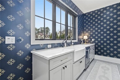 Situated within the prestigious Indian Hills Country Club on Indian Hills Country Club in Georgia - for sale on GolfHomes.com, golf home, golf lot