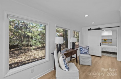 Absolutely stunning modern treehouse renovation in Raintree on Raintree Country Club in North Carolina - for sale on GolfHomes.com, golf home, golf lot