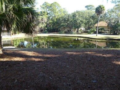 Desirable Duplex Style villa overlooking a scenic pond in gated on The Plantation Course At Edisto in South Carolina - for sale on GolfHomes.com, golf home, golf lot