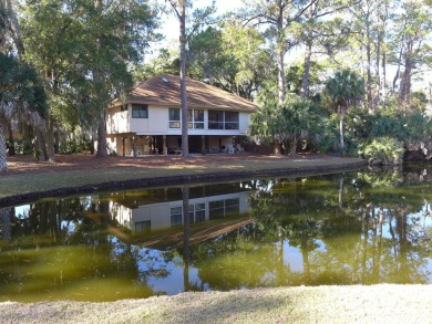 Desirable Duplex Style villa overlooking a scenic pond in gated on The Plantation Course At Edisto in South Carolina - for sale on GolfHomes.com, golf home, golf lot