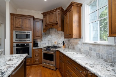 Experience lakefront living at its finest in this stunning on Old North State Club at Uwharrie Point Golf community in North Carolina - for sale on GolfHomes.com, golf home, golf lot