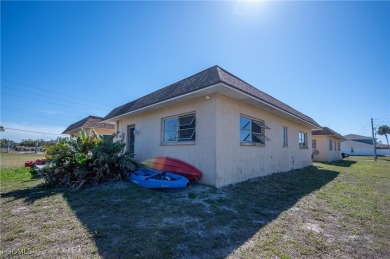 Quadruple your income with this fully rented WATERFRONT QUADPLEX on Rotonda Golf and Country Club The Hills Course in Florida - for sale on GolfHomes.com, golf home, golf lot