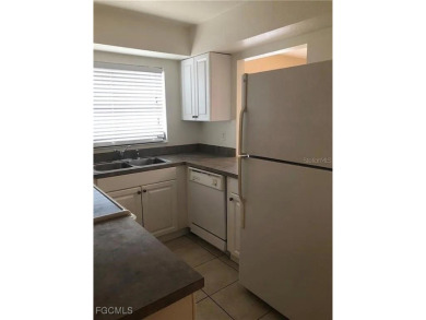Quadruple your income with this fully rented WATERFRONT QUADPLEX on Rotonda Golf and Country Club The Hills Course in Florida - for sale on GolfHomes.com, golf home, golf lot