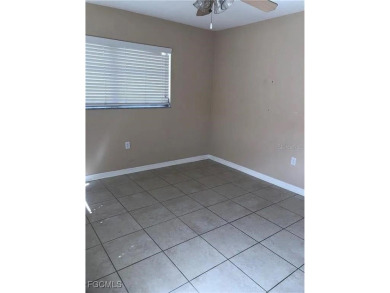 Quadruple your income with this fully rented WATERFRONT QUADPLEX on Rotonda Golf and Country Club The Hills Course in Florida - for sale on GolfHomes.com, golf home, golf lot