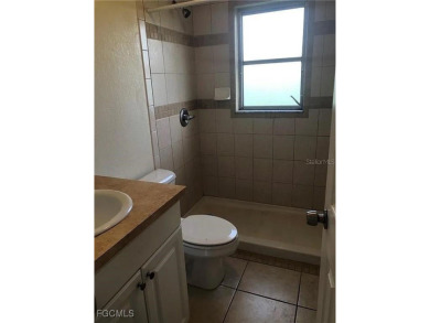 Quadruple your income with this fully rented WATERFRONT QUADPLEX on Rotonda Golf and Country Club The Hills Course in Florida - for sale on GolfHomes.com, golf home, golf lot