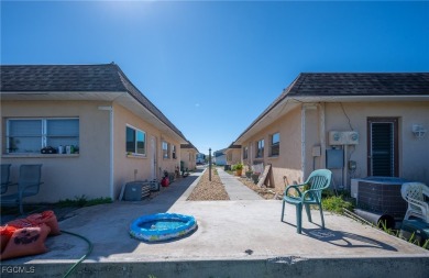 Quadruple your income with this fully rented WATERFRONT QUADPLEX on Rotonda Golf and Country Club The Hills Course in Florida - for sale on GolfHomes.com, golf home, golf lot