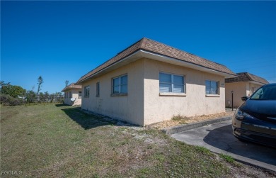 Quadruple your income with this fully rented WATERFRONT QUADPLEX on Rotonda Golf and Country Club The Hills Course in Florida - for sale on GolfHomes.com, golf home, golf lot