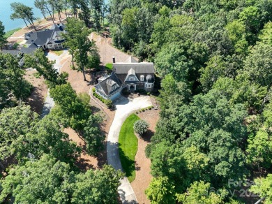 Experience lakefront living at its finest in this stunning on Old North State Club at Uwharrie Point Golf community in North Carolina - for sale on GolfHomes.com, golf home, golf lot