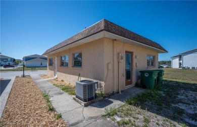 Quadruple your income with this fully rented WATERFRONT QUADPLEX on Rotonda Golf and Country Club The Hills Course in Florida - for sale on GolfHomes.com, golf home, golf lot