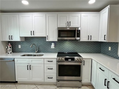 **WOW! A CORNER LOT*DBL GARAGE* AND AN EXTRA 2 SPACE PARKING on Cypress Lake Country Club in Florida - for sale on GolfHomes.com, golf home, golf lot