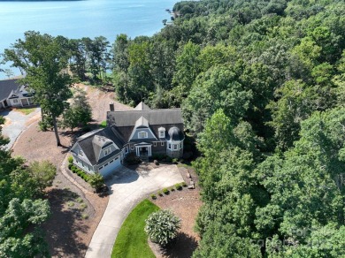 Experience lakefront living at its finest in this stunning on Old North State Club at Uwharrie Point Golf community in North Carolina - for sale on GolfHomes.com, golf home, golf lot