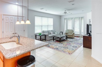 Charming 2 bedroom, 2 bath home with a study is nestled in the on Stonegate Golf Club in Florida - for sale on GolfHomes.com, golf home, golf lot