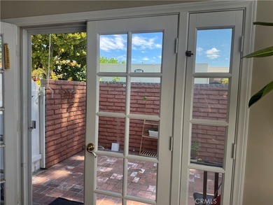 Elegant two-bedroom, two-bathroom home in Laguna Woods offering on Laguna Woods Village Golf Course in California - for sale on GolfHomes.com, golf home, golf lot