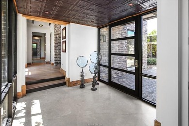 Experience luxury redefined in this private 6,021 SqFt custom on The Traditions Club At Texas A and M in Texas - for sale on GolfHomes.com, golf home, golf lot