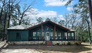 This charming 3-bedroom, 2-bathroom, 1600 sf house is nestled in on Holly Lake Ranch Golf Club in Texas - for sale on GolfHomes.com, golf home, golf lot