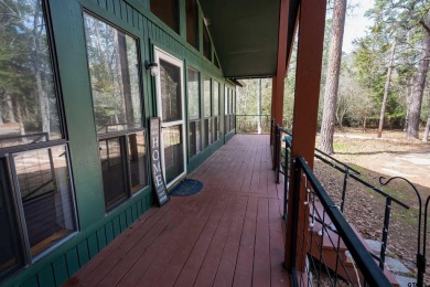 This charming 3-bedroom, 2-bathroom, 1600 sf house is nestled in on Holly Lake Ranch Golf Club in Texas - for sale on GolfHomes.com, golf home, golf lot