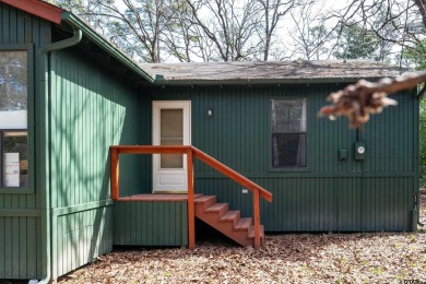 This charming 3-bedroom, 2-bathroom, 1600 sf house is nestled in on Holly Lake Ranch Golf Club in Texas - for sale on GolfHomes.com, golf home, golf lot