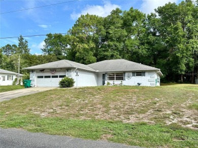 This 3-bedroom, 2-bath block home in Citrus Springs is exactly on Citrus Springs Country Club in Florida - for sale on GolfHomes.com, golf home, golf lot