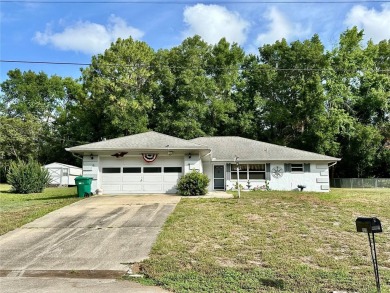 This 3-bedroom, 2-bath block home in Citrus Springs is exactly on Citrus Springs Country Club in Florida - for sale on GolfHomes.com, golf home, golf lot