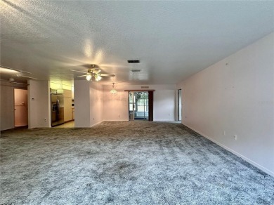 This 3-bedroom, 2-bath block home in Citrus Springs is exactly on Citrus Springs Country Club in Florida - for sale on GolfHomes.com, golf home, golf lot
