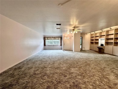 This 3-bedroom, 2-bath block home in Citrus Springs is exactly on Citrus Springs Country Club in Florida - for sale on GolfHomes.com, golf home, golf lot