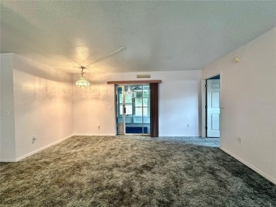 This 3-bedroom, 2-bath block home in Citrus Springs is exactly on Citrus Springs Country Club in Florida - for sale on GolfHomes.com, golf home, golf lot