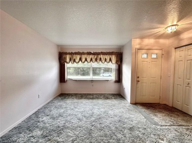 This 3-bedroom, 2-bath block home in Citrus Springs is exactly on Citrus Springs Country Club in Florida - for sale on GolfHomes.com, golf home, golf lot