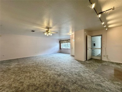 This 3-bedroom, 2-bath block home in Citrus Springs is exactly on Citrus Springs Country Club in Florida - for sale on GolfHomes.com, golf home, golf lot