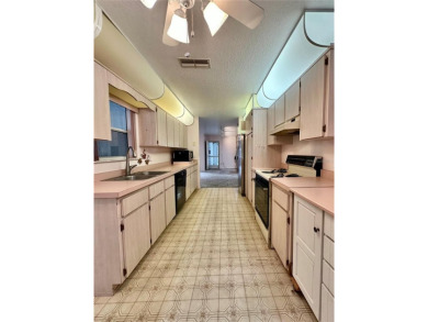 This 3-bedroom, 2-bath block home in Citrus Springs is exactly on Citrus Springs Country Club in Florida - for sale on GolfHomes.com, golf home, golf lot