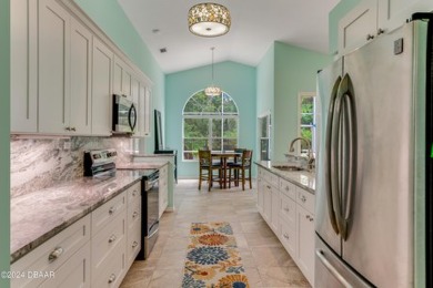 Make this beautifully updated home your new address in gated on Plantation Bay Golf and Country Club in Florida - for sale on GolfHomes.com, golf home, golf lot