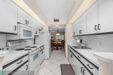 Fully furnished TURNKEY unit with full sized washer and dryer on Wynmoor Golf Course in Florida - for sale on GolfHomes.com, golf home, golf lot