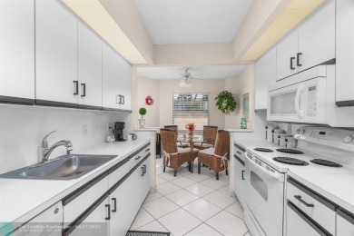 Fully furnished TURNKEY unit with full sized washer and dryer on Wynmoor Golf Course in Florida - for sale on GolfHomes.com, golf home, golf lot