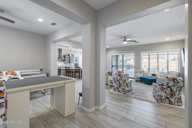 PRICED BELOW MARKET - MOVE-IN READY WITH OVER $73K IN BUILDER on Poston Butte Golf Club in Arizona - for sale on GolfHomes.com, golf home, golf lot