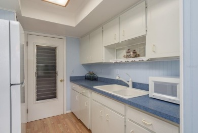 RARE OPPORTUNITY TO OWN A WATERFRONT CORNER VILLA NESTLED IN on Highland Lakes Executive Golf Course in Florida - for sale on GolfHomes.com, golf home, golf lot