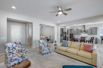 PRICED BELOW MARKET - MOVE-IN READY WITH OVER $73K IN BUILDER on Poston Butte Golf Club in Arizona - for sale on GolfHomes.com, golf home, golf lot