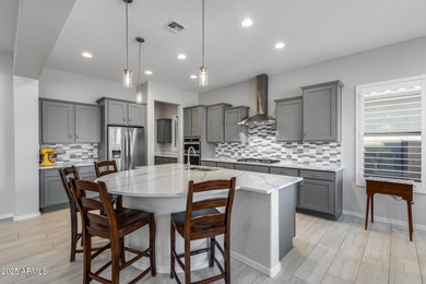 PRICED BELOW MARKET - MOVE-IN READY WITH OVER $73K IN BUILDER on Poston Butte Golf Club in Arizona - for sale on GolfHomes.com, golf home, golf lot